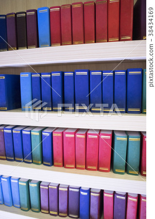 various of colourful books on shelf various of colourful books on shelf 38434169