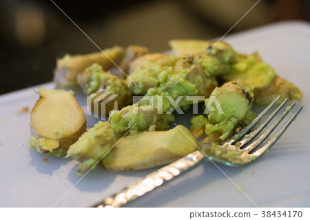 Wasabi with ginger on cutting board in kitchen Wasabi with ginger on cutting board in kitchen 38434170