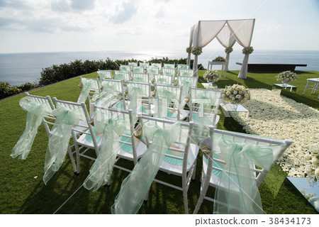 Wedding arch decorated with white and green flower Wedding arch decorated with white and green flower 38434173
