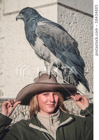 Female with an eagle sitting on her hat 38434805