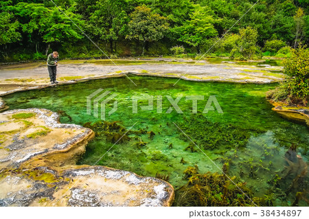 Tourist at the Baishuitai Water Terraces in China Tourist at the Baishuitai Water Terraces in China 38434897