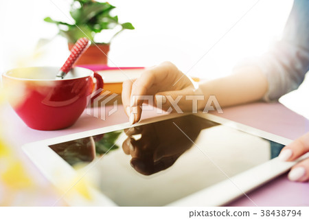 Woman and fruit diet while working on computer in Woman and fruit diet while working on computer in 38438794