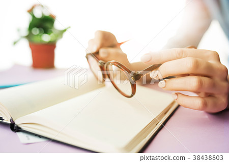 The female hands holding glasses. The trendy pink The female hands holding glasses. The trendy pink 38438803