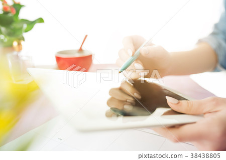 Woman and fruit diet while working on computer in Woman and fruit diet while working on computer in 38438805