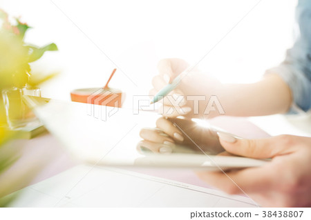 Woman and fruit diet while working on computer in Woman and fruit diet while working on computer in 38438807