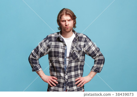 The serious business man standing and looking at The serious business man standing and looking at 38439073