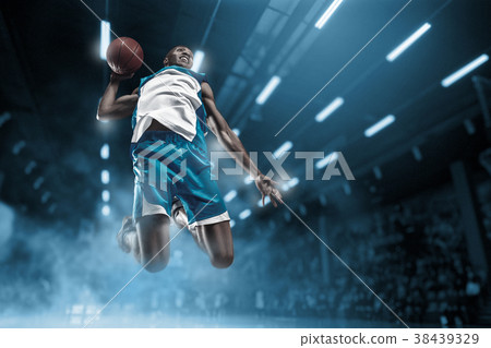 Basketball player on big professional arena during 38439329