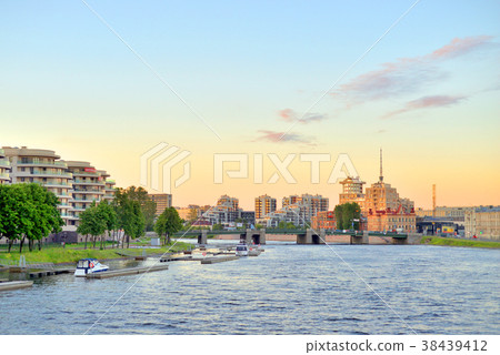 Embankment of Malaya Nevka River at sunset. 38439412