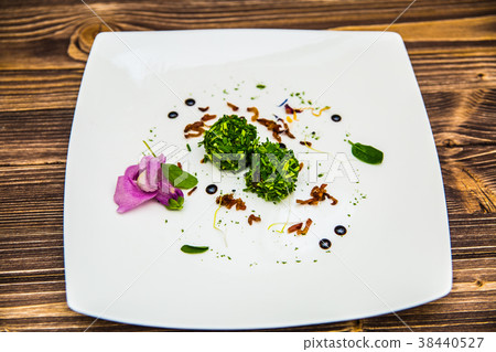 Food on a plate, on a wooden background Food on a plate, on a wooden background 38440527