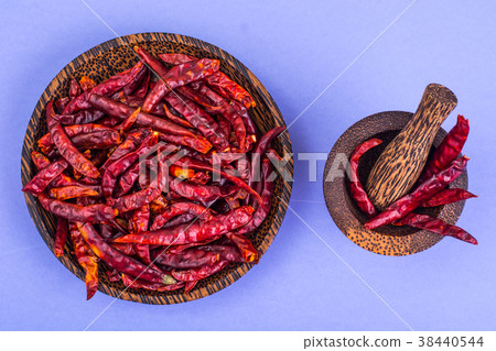 Many pods of dried chili red pepper on pastel 38440544