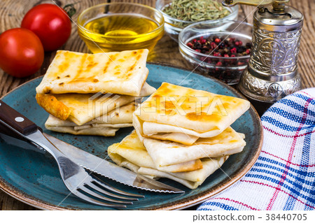 Envelopes of thin Armenian bread lavash fried with Envelopes of thin Armenian bread lavash fried with 38440705