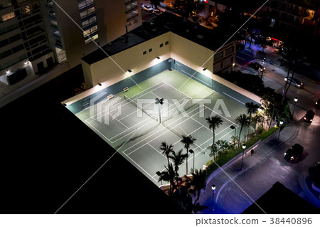 Tennis courts at night from above 38440896