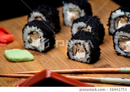 Sushi zuko with shrimp and black masago caviar. 38441753