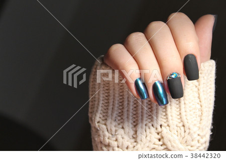 Women's hands with a stylish manicure. 38442320