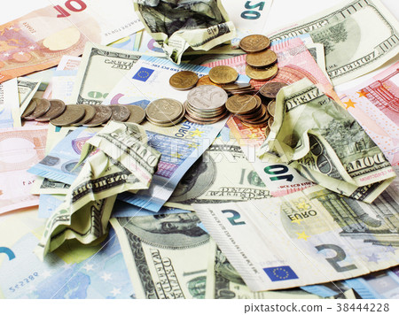 Cash on table isolated: dollars, euro, rubl broken Cash on table isolated: dollars, euro, rubl broken 38444228