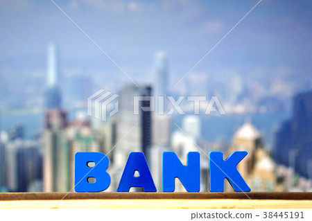 BANK text on top wooden working table with city 38445191
