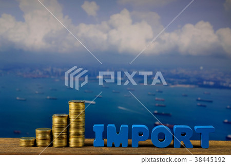 IMPORT text and coin on wood table over seascape IMPORT text and coin on wood table over seascape 38445192