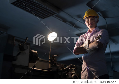 Mechanic engineer turner miller in factory. Mechanic engineer turner miller in factory. 38446227