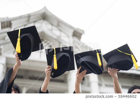 Many hand holding Row of graduation hats on Sky. 38446602