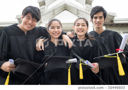 Happily graduates group giving a certificate. Happily graduates group giving a certificate. 38446603