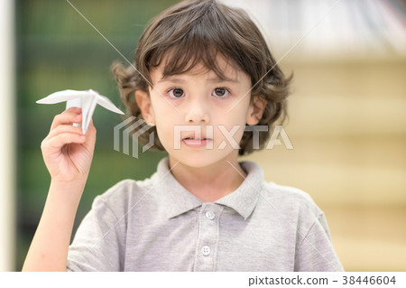 Cute boy with Paper rocket in hand. 38446604