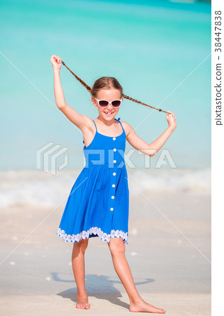 Adorable little girl at beach during summer 38447838