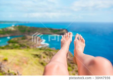 Female feet background the view of English Harbor Female feet background the view of English Harbor 38447936
