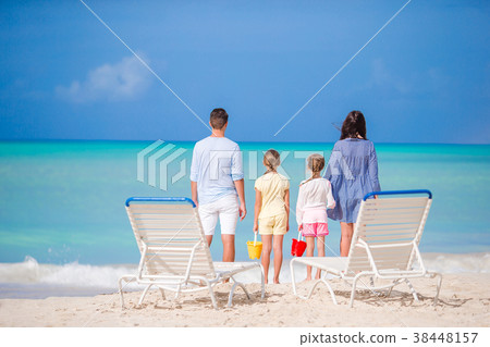 Family of four on beach vacation Family of four on beach vacation 38448157