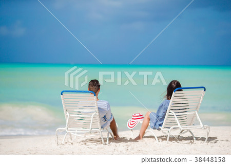 Couple relax on a tropical beach Couple relax on a tropical beach 38448158