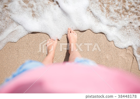 Close up of female feet on white sandy beach Close up of female feet on white sandy beach 38448178