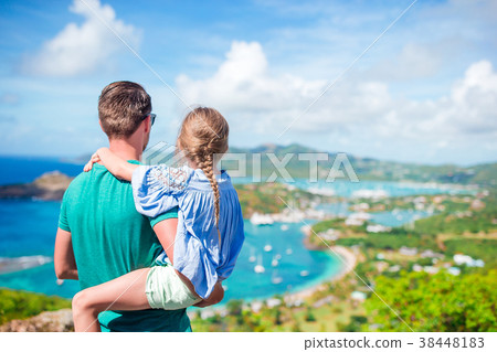 Family of dad and little kid enjoying the view of Family of dad and little kid enjoying the view of 38448183