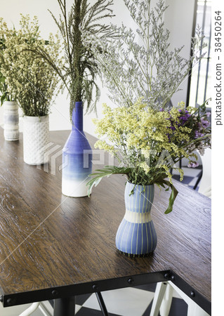 Beautiful flower vase decorated on wooden table Beautiful flower vase decorated on wooden table 38450264
