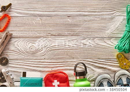 Travel items for hiking over wooden background 38450504