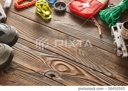 Travel items for hiking over wooden background 38450505