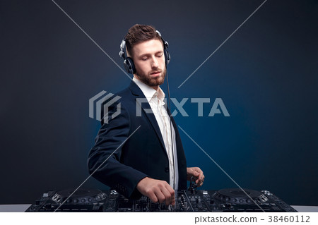 Closeup portrait of confident DJ with stylish hair Closeup portrait of confident DJ with stylish hair 38460112