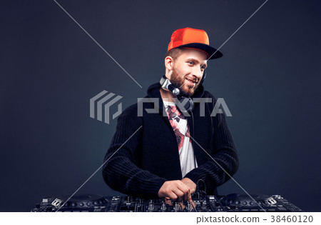 Man play music on a dj's mixer. Studio shot. Man play music on a dj's mixer. Studio shot. 38460120