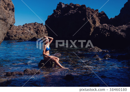 beautiful girl resting in natural ocean swimming 38460180
