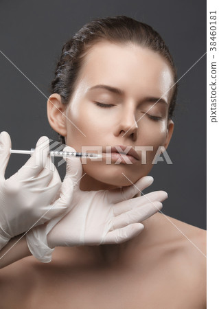 Portrait of young Caucasian woman getting cosmetic 38460181