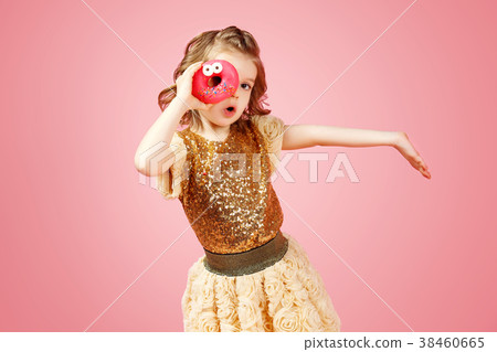 Girl looking through donut hole Girl looking through donut hole 38460665