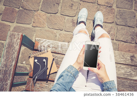 Woman using modern white smartphone. Top view Woman using modern white smartphone. Top view 38461436