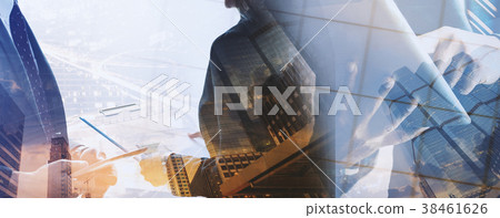 Businessmen and business women are using a tablet. Businessmen and business women are using a tablet. 38461626