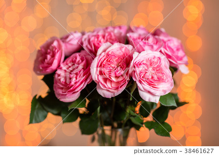 Pink rose. Vase with beautiful bouquet on table 38461627
