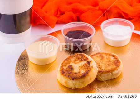 Cottage cheese cheesecakes, are served with sour c 38462269