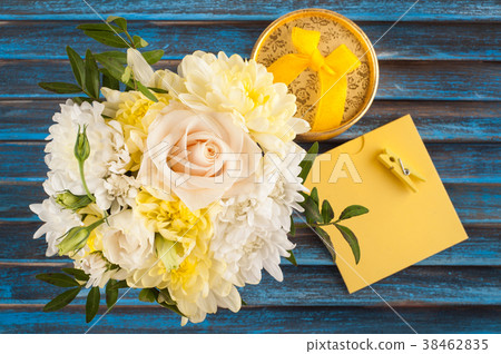 Yellow pink bouquet flowers on blue 38462835