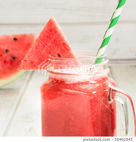 Summer healthy watermelon smoothie on white board Summer healthy watermelon smoothie on white board 38462845