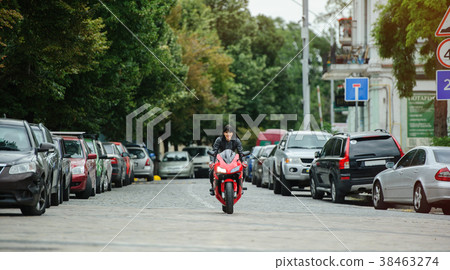 A biker girl in a leather jacket on a motorcycle A biker girl in a leather jacket on a motorcycle 38463274