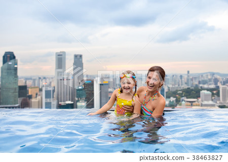 Kids swim in Singapore roof top swimming pool Kids swim in Singapore roof top swimming pool 38463827