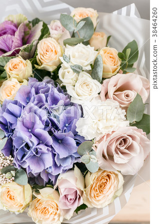 beautiful bouquet of mixed flowers into a vase on beautiful bouquet of mixed flowers into a vase on 38464260