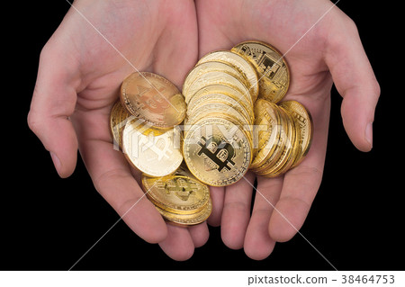 hand holding a pile of golden bitcoins hand holding a pile of golden bitcoins 38464753