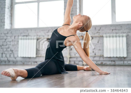 Young woman in sportswear doing stretching Young woman in sportswear doing stretching 38464843